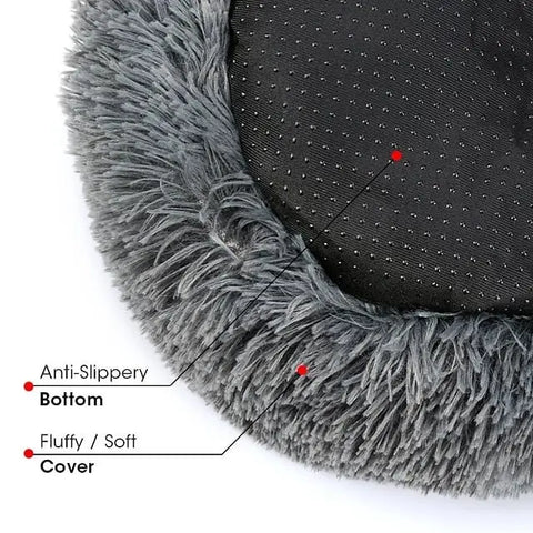 Dog sleeping in round pet bed